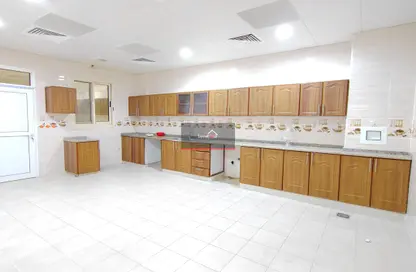 Kitchen image for: Compound - 7 Bedrooms for rent in Mohamed Bin Zayed City - Abu Dhabi, Image 1