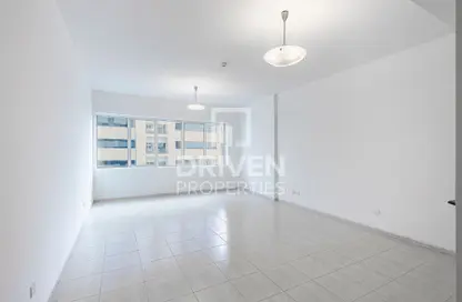 Empty Room image for: Apartment - 1 Bedroom - 2 Bathrooms for sale in Olympic Park 3 - Olympic Park Towers - Dubai Sports City - Dubai, Image 1