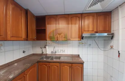 صورة لـ مطبخ شقة - 2 غرف نوم - 2 حمامات للايجار في شارع حمدان - أبوظبي ، صورة رقم 1