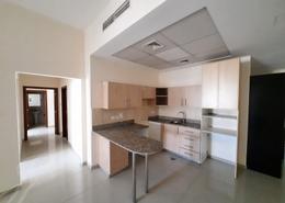 Kitchen image for: Apartment - 2 bedrooms for rent in Madison Residences - Majan - Dubai, Image 1