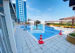 Pool image for: Studio - 1 bathroom for rent in Jamal Tower - Al Nahyan Camp - Abu Dhabi, Image 1