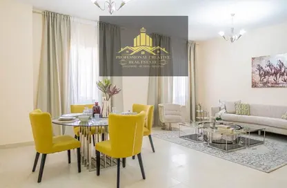 Living / Dining Room image for: Apartment - 1 Bedroom - 2 Bathrooms for sale in Al Ameera Village - Ajman, Image 1