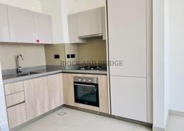 Kitchen image for: Apartment - 1 bedroom - 2 bathrooms for rent in Sobha Hartland Waves Opulence - Nad Al Sheba 1 - Nadd Al Sheba - Dubai, Image 1