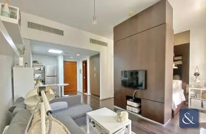 Living Room image for: Apartment - 1 Bathroom for sale in Regent House 1 - Regent House - Motor City - Dubai, Image 1