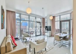 Living / Dining Room image for: Apartment - 2 bedrooms - 2 bathrooms for rent in Boulevard Crescent 2 - BLVD Crescent - Downtown Dubai - Dubai, Image 1