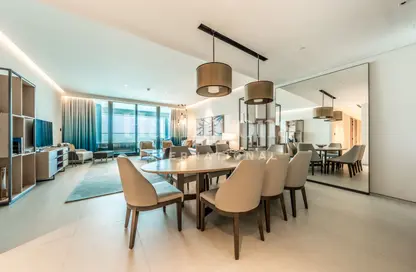 Living / Dining Room image for: Apartment - 4 Bedrooms - 6 Bathrooms for sale in Jumeirah Gate Tower 2 - The Address Jumeirah Resort and Spa - Jumeirah Beach Residence - Dubai, Image 1