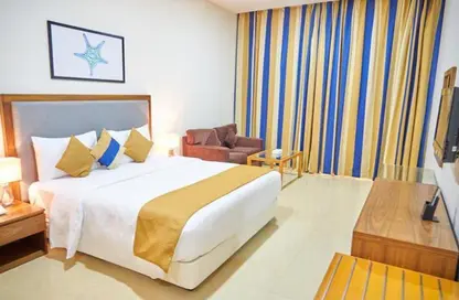 صورة لـ غرفة- غرفة النوم النزل و الشقق الفندقية - غرفة نوم - 1 حمام للايجار في البرشاء 1 - البرشاء - دبي ، صورة رقم 1