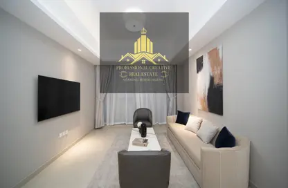 Living Room image for: Apartment - 2 Bedrooms - 2 Bathrooms for sale in AZHA Community - Al Amerah - Ajman, Image 1