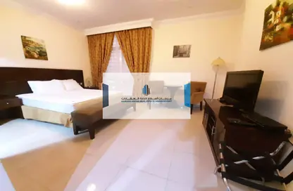 Room / Bedroom image for: Apartment - 1 Bathroom for rent in Airport Road - Abu Dhabi, Image 1
