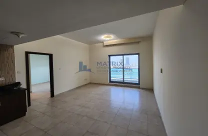 Empty Room image for: Apartment - 1 Bedroom - 2 Bathrooms for rent in The Diamond - Dubai Sports City - Dubai, Image 1