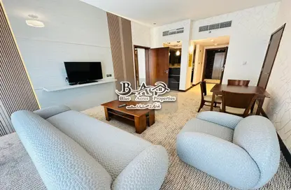 صورة لـ غرفة المعيشة شقة - غرفة نوم - 1 حمام للايجار في فندق بلومونت كابيتال - دانة بو ظبي - أبوظبي ، صورة رقم 1