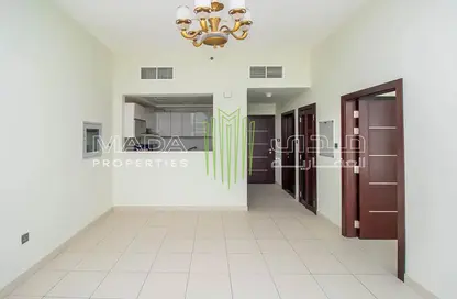 Empty Room image for: Apartment - 1 Bedroom - 2 Bathrooms for sale in Glitz 3 - Glitz - Dubai Studio City - Dubai, Image 1
