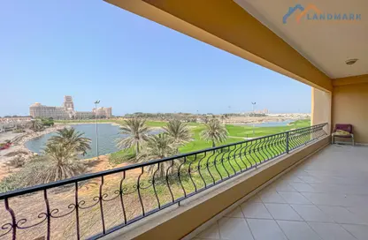 Balcony image for: Apartment - 1 Bedroom - 2 Bathrooms for sale in Golf Apartments - Al Hamra Village - Ras Al Khaimah, Image 1