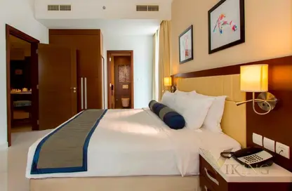 Room / Bedroom image for: Apartment - 2 Bedrooms - 2 Bathrooms for rent in Treppan Hotel  and  Suites by Fakhruddin - Dubai Sports City - Dubai, Image 1