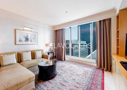 Living Room image for: Hotel and Hotel Apartment - 3 bedrooms - 3 bathrooms for rent in Ritz Carlton - DIFC - Dubai, Image 1