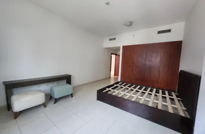 Room / Bedroom image for: Apartment - 1 Bedroom - 2 Bathrooms for rent in Olympic Park 4 - Olympic Park Towers - Dubai Sports City - Dubai, Image 1