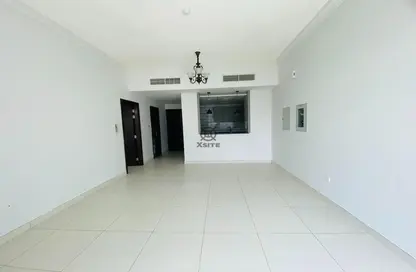 Empty Room image for: Apartment - 1 Bedroom - 2 Bathrooms for rent in Venus Residence - Jumeirah Village Circle - Dubai, Image 1
