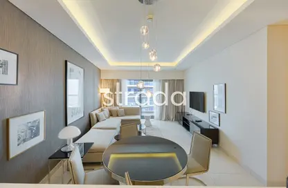 Living / Dining Room image for: Apartment - 1 Bedroom - 2 Bathrooms for sale in Tower A - DAMAC Towers by Paramount - Business Bay - Dubai, Image 1