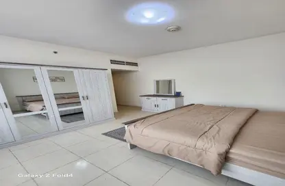 شقة - غرفة نوم - 2 حمامات للبيع في أورينت تاور 1 - أورينت تاور - البستان - عجمان