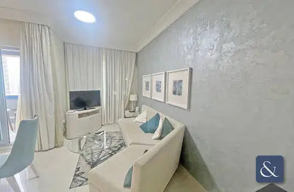 صورة لـ غرفة المعيشة شقة - غرفة نوم - 2 حمامات للايجار في ذا سيجنتشر - برج خليفة - دبي وسط المدينة - دبي ، صورة رقم 1