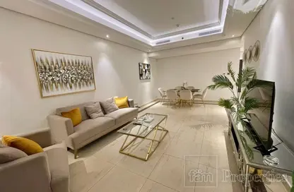 Living Room image for: Apartment - 2 Bedrooms - 3 Bathrooms for sale in Mon Reve - Downtown Dubai - Dubai, Image 1