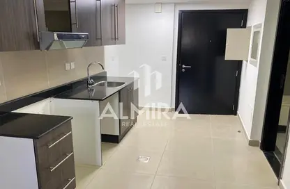 Kitchen image for: Apartment - 1 Bathroom for sale in Tower 44 - Al Reef Downtown - Al Reef - Abu Dhabi, Image 1