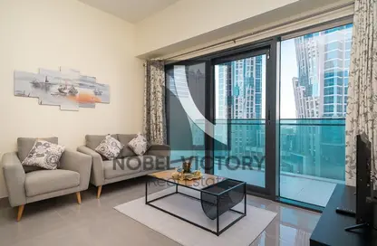 Living Room image for: Apartment - 1 Bedroom - 2 Bathrooms for sale in Merano Tower - Business Bay - Dubai, Image 1