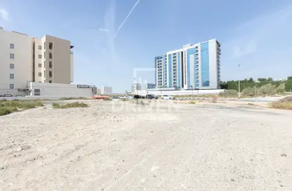صورة لـ مبنى خارجي أرض - استوديو للبيع في مجان وان رزيدنسز - مجان - دبي ، صورة رقم 1