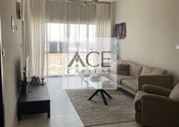 Living Room image for: Apartment - 1 bedroom - 1 bathroom for sale in MAG 530 - Mag 5 Boulevard - Dubai South (Dubai World Central) - Dubai, Image 1