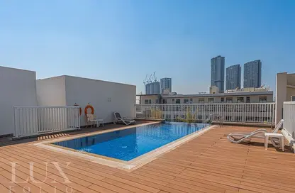 Pool image for: Apartment - 1 Bedroom - 2 Bathrooms for sale in Laya Residences - Jumeirah Village Circle - Dubai, Image 1