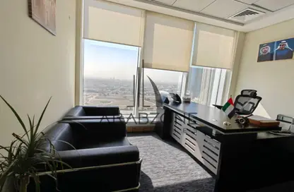 نصف طابق - استوديو - 2 حمامات للايجار في برج المنارة - الخليج التجاري - دبي