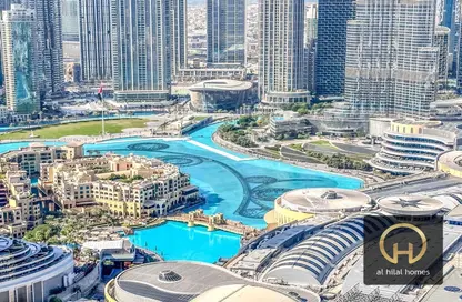 صورة لـ حوض سباحة شقة - 2 غرف نوم - 3 حمامات للايجار في العنوان رزيدنس فاونتن فيوز 1 - العنوان رزيدنس فاونتن فيوز - دبي وسط المدينة - دبي ، صورة رقم 1