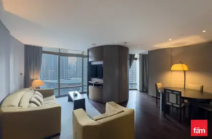 Living Room image for: Apartment - 1 Bedroom - 2 Bathrooms for rent in Armani Residence - Burj Khalifa Area - Downtown Dubai - Dubai, Image 1