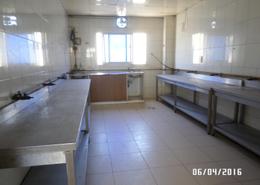 صورةمطبخ لـ: سكن عمال - 8 حمامات للكراء في سونابور - المحيصنة - دبي, صورة 1