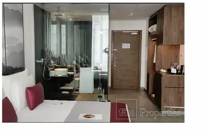 صورة لـ غرفة المعيشة / غرفة الطعام النزل و الشقق الفندقية - 1 حمام للبيع في فندق ذا وان - الخليج التجاري - دبي ، صورة رقم 1