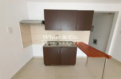 Kitchen image for: Apartment - 1 Bathroom for rent in Noora Residence 1 - Noora Residence - Jumeirah Village Circle - Dubai, Image 1