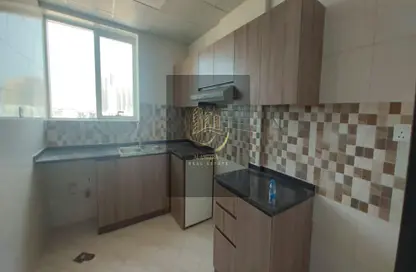 Kitchen image for: Apartment - 2 Bedrooms - 3 Bathrooms for rent in Al Ameera Village - Ajman, Image 1