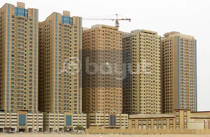 Outdoor Building image for: Apartment - 2 Bedrooms - 2 Bathrooms for sale in Paradise Lakes Tower B9 - Paradise Lakes Towers - Emirates City - Ajman, Image 1