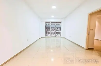 Empty Room image for: Apartment - 1 Bedroom - 2 Bathrooms for sale in Laya Residences - Jumeirah Village Circle - Dubai, Image 1