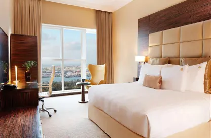 Room / Bedroom image for: Hotel  and  Hotel Apartment - Studio - 1 Bathroom for rent in Jannah Burj Al Sarab - Mina Road - Tourist Club Area - Abu Dhabi, Image 1