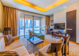 صورةغرفة المعيشة / غرفة الطعام لـ: شقة - 1 غرفة نوم - 2 حمامات للبيع في فندق العنوان دبي مول - دبي وسط المدينة - دبي, صورة 1