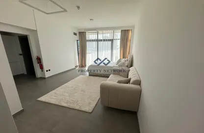 Living Room image for: Apartment - 1 Bathroom for sale in V2 - Dubai Sports City - Dubai, Image 1