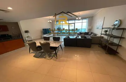 Living / Dining Room image for: Apartment - 2 Bedrooms - 3 Bathrooms for sale in Corniche Tower - Ajman Corniche Road - Ajman, Image 1