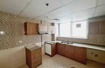 Kitchen image for: Apartment - 3 Bedrooms - 3 Bathrooms for rent in Ibtikar 1 - Al Majaz 2 - Al Majaz - Sharjah, Image 1