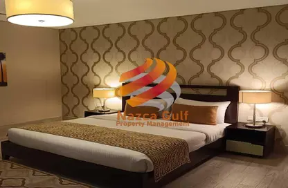 Room / Bedroom image for: Apartment - 1 Bedroom - 2 Bathrooms for rent in Hamdan Street - Abu Dhabi, Image 1