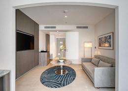 صورةغرفة المعيشة لـ: النزل و الشقق الفندقية - 1 حمام للبيع في ذا ون في جميرا فيلاج سيركل - قرية الجميرا سركل - دبي, صورة 1