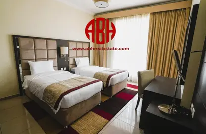 Room / Bedroom image for: Apartment - 3 Bedrooms - 3 Bathrooms for sale in Siraj Tower - Arjan - Dubai, Image 1