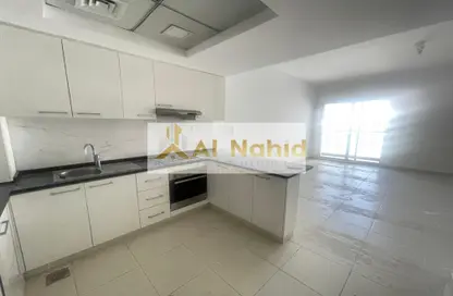 Kitchen image for: Apartment - 1 Bathroom for rent in Oxford Building - Jumeirah Village Circle - Dubai, Image 1