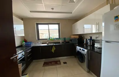 صورة لـ مطبخ شقة - 2 غرف نوم - 3 حمامات للبيع في إيريس - عزيزي ريزيدنس - الفرجان - دبي ، صورة رقم 1