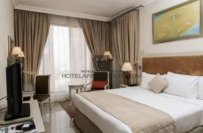 صورة لـ غرفة- غرفة النوم النزل و الشقق الفندقية - غرفة نوم - 1 حمام للايجار في ميركيور دبي برشا هايتس للاجنحة والشقق الفندقية - برشا هايتس (تيكوم) - دبي ، صورة رقم 1
